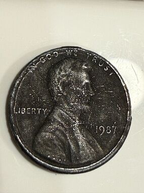 1987 Lincoln Penny — Error Penny in that it was not dipped for copper coating.